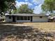 Back of the house with a screened in porch and spacious backyard at 3045 Plaza Terrace Dr, Orlando, FL 32803
