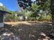 Expansive backyard with mature trees and plenty of space for recreation at 3045 Plaza Terrace Dr, Orlando, FL 32803