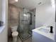 Stylish bathroom with frameless shower, Herringbone tile floor, modern fixtures, and a white vanity at 3045 Plaza Terrace Dr, Orlando, FL 32803