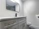 Modern bathroom featuring a sleek vanity, stylish faucet, and glass-enclosed shower at 3045 Plaza Terrace Dr, Orlando, FL 32803