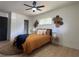 Comfortable bedroom with light walls, wood floor, ceiling fan, and woven wall art accents at 3045 Plaza Terrace Dr, Orlando, FL 32803