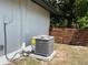 Exterior shot of the AC unit, with fenced yard in background at 3045 Plaza Terrace Dr, Orlando, FL 32803