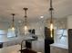 Modern kitchen featuring pendant lighting, stainless appliances, and white cabinetry at 3045 Plaza Terrace Dr, Orlando, FL 32803