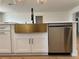 Close-up of a kitchen island with a stainless steel dishwasher and bronze sink at 3045 Plaza Terrace Dr, Orlando, FL 32803