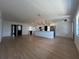 Bright and open living area with wood floors, a modern kitchen with a large island, and stylish finishes at 3045 Plaza Terrace Dr, Orlando, FL 32803