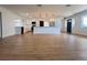 Large living room featuring wood floors, a modern kitchen with an island, and stainless steel appliances at 3045 Plaza Terrace Dr, Orlando, FL 32803