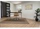 Functional home office space features a sleek desk, comfortable chair, and ample natural light at 3045 Plaza Terrace Dr, Orlando, FL 32803