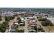 An aerial view of single-Gathering homes situated within a neighborhood close to local community amenities at 31 Cedar St, Haines City, FL 33844