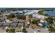 An aerial view of a neighborhood featuring single-Gathering homes close to businesses and roadways at 31 Cedar St, Haines City, FL 33844