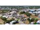 An aerial view showcases a residential neighborhood featuring homes with mature trees and a mix of architectural styles at 31 Cedar St, Haines City, FL 33844