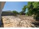 Large, sunny backyard with minimal landscaping and a chain-link fence at 31 Cedar St, Haines City, FL 33844