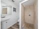 Bright bathroom features tile shower and single sink pedestal at 31 Cedar St, Haines City, FL 33844