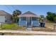 Charming single-story home featuring a cozy front porch, fenced yard, and classic architectural details at 31 Cedar St, Haines City, FL 33844