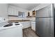 Updated kitchen featuring stainless steel appliances and ample cabinet space at 31 Cedar St, Haines City, FL 33844