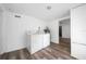 Laundry area equipped with a washer, dryer, and water heater at 31 Cedar St, Haines City, FL 33844
