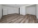 Living room boasts plank flooring and access to other rooms at 31 Cedar St, Haines City, FL 33844