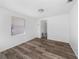 Bright room with wood-look floors and a window offering natural light at 31 Cedar St, Haines City, FL 33844
