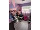 Unique bedroom with pink and purple color block paint and organized clothes at 311 Congress Ave, Auburndale, FL 33823