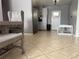 Dining room showcasing tile floors, and a crib at 311 Congress Ave, Auburndale, FL 33823