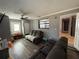 Inviting living room features gray walls, dark floors and plenty of space for Gathering at 311 Congress Ave, Auburndale, FL 33823