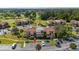 Aerial view of condominium complex showing parking, landscaping, and surrounding area at 3235 Candle Ridge Dr # 102, Orlando, FL 32822