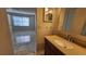 Bathroom featuring large sink and vanity, and a view to the main bedroom at 3235 Candle Ridge Dr # 102, Orlando, FL 32822