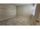 Bright bedroom featuring large tiled floors and sunshades allowing natural light at 3235 Candle Ridge Dr # 102, Orlando, FL 32822