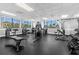 Community gym with modern workout equipment and lots of natural light from large windows at 3235 Candle Ridge Dr # 102, Orlando, FL 32822