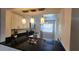 Kitchen with black countertops, stainless steel appliances, white cabinets, and a modern design at 3235 Candle Ridge Dr # 102, Orlando, FL 32822