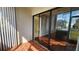 Screened lanai with tile flooring, glass sliding doors, and serene outdoor view at 3235 Candle Ridge Dr # 102, Orlando, FL 32822