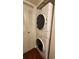 Laundry room featuring updated stackable washer and dryer and extra storage at 3235 Candle Ridge Dr # 102, Orlando, FL 32822