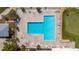 Aerial view of a large, community pool with plenty of lounge chairs surrounding it, perfect for relaxation at 3235 Candle Ridge Dr # 102, Orlando, FL 32822