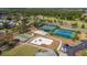 Aerial shot of community recreational area featuring tennis, shuffleboard, basketball, and playground at 3235 Candle Ridge Dr # 102, Orlando, FL 32822