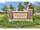The Grandview Gardens brick community sign is surrounded by green landscaping at 331 Alexandrite St, Deland, FL 32720