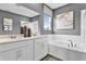 Modern bathroom with double vanity, soaking tub, separate shower, and elegant finishes at 333 Alexandrite St, Deland, FL 32720