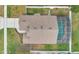 An aerial view of a pool and backyard of a residence; the shot is taken from directly above at 3886 Creek Bed Cir, St Cloud, FL 34769