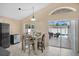 Cozy dining area next to the kitchen with sliding doors to a beautiful lanai and pool at 3886 Creek Bed Cir, St Cloud, FL 34769