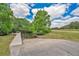 Picturesque boat dock on the water, surrounded by lush greenery and under a beautiful sky at 3886 Creek Bed Cir, St Cloud, FL 34769