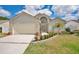 Charming single Gathering home with brick accents, manicured landscaping, and inviting front entrance at 3886 Creek Bed Cir, St Cloud, FL 34769