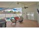 Outdoor patio and screened-in pool area with comfortable seating, ideal for relaxation at 3886 Creek Bed Cir, St Cloud, FL 34769