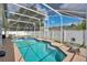 Inviting screened-in pool area with a hot tub, perfect for relaxation and entertainment at 3886 Creek Bed Cir, St Cloud, FL 34769