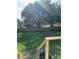 Spacious backyard with a wooden fence line and mature trees at 4385 Ne 2Nd Ct, Ocala, FL 34479