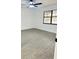 Bedroom boasts durable gray flooring and neutral wall colors with an updated window at 4385 Ne 2Nd Ct, Ocala, FL 34479