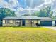 Charming single-story home with stone accents, well-maintained lawn, and a cozy front porch at 4385 Ne 2Nd Ct, Ocala, FL 34479