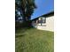 View of the home exterior features dark framed windows and siding at 4385 Ne 2Nd Ct, Ocala, FL 34479