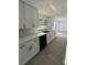 Modern kitchen featuring sleek white cabinets, updated countertops, and stainless steel appliances at 4385 Ne 2Nd Ct, Ocala, FL 34479