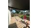 Relaxing outdoor patio with chairs and a table, offering a great view of the backyard at 4385 Ne 2Nd Ct, Ocala, FL 34479
