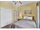 Inviting bedroom with a cozy bed, neutral tones, and ample storage in a white closet at 4739 Cumbrian Lakes Dr, Kissimmee, FL 34746