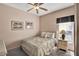 Serene bedroom featuring a decorative bedspread, soft lighting, and a view of the outdoors at 4739 Cumbrian Lakes Dr, Kissimmee, FL 34746