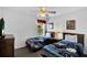 Bright bedroom featuring two twin beds with Star Wars bedding and a ceiling fan at 4739 Cumbrian Lakes Dr, Kissimmee, FL 34746
